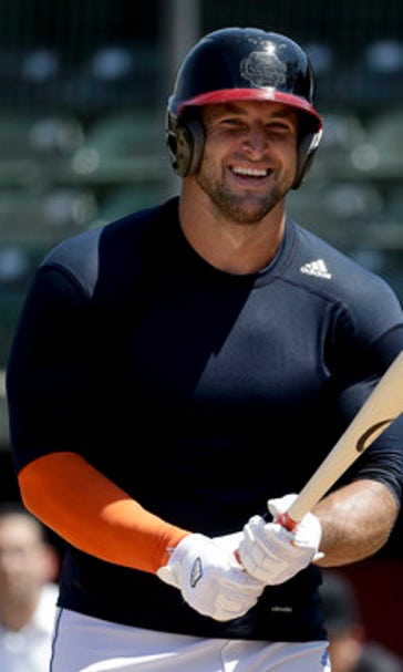 Determined to chase dream, Tebow shows power in MLB workout